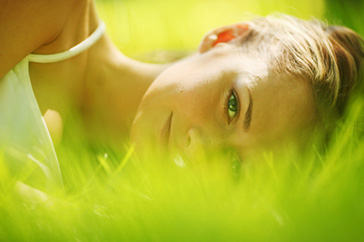 Woman sleeping on grass