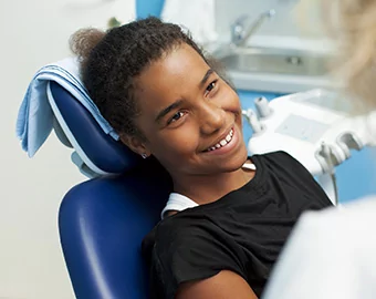 A young child in a dentist's chair