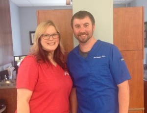 Dr. Alex Hamilton posing for a photo with a staff member