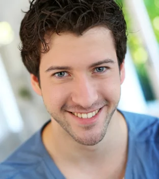 Young man smiling with corrected and whitened teeth