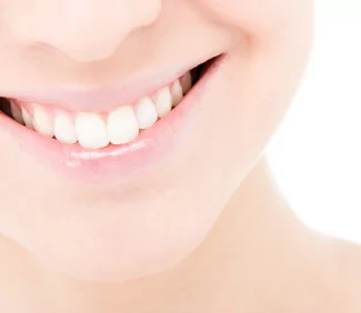 Young woman smiling with whitened teeth